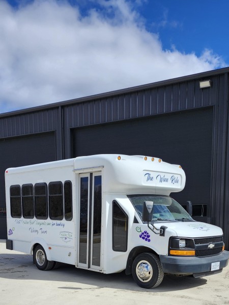 A shuttle bus with wine decorations